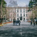 International students walking through a European university campus