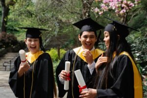 University graduates celebrating with their diplomas