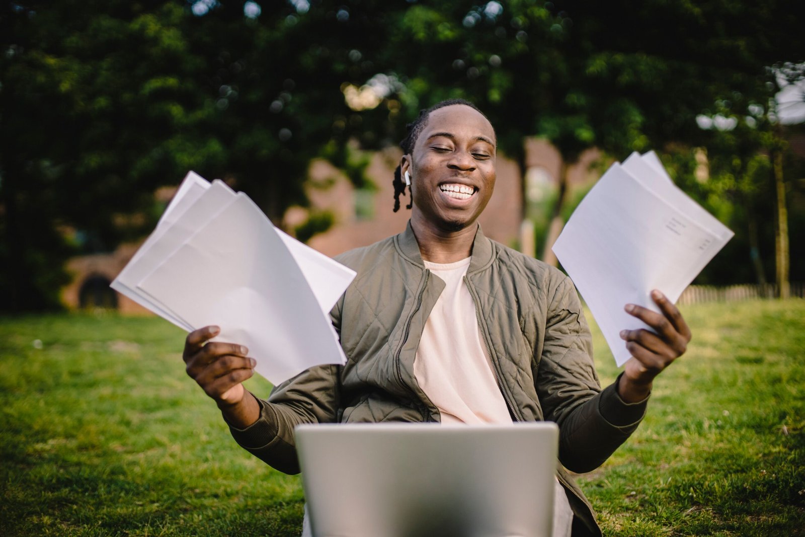 Student researching scholarships he qualifies for using a laptop