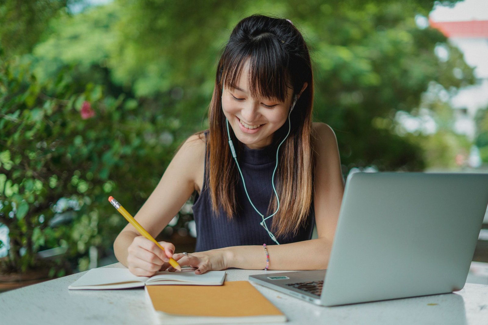 Student writing a winning scholarship essay using a laptop